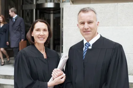 judges standing together outside courthouse