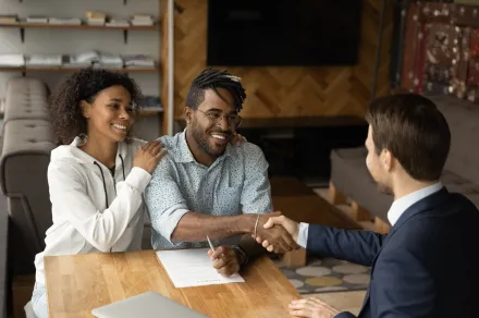 A lawyer shaking the hand of a client 