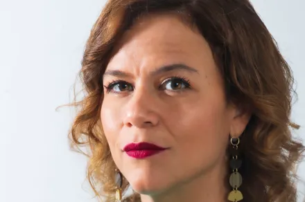 headshot of woman with red lipstick