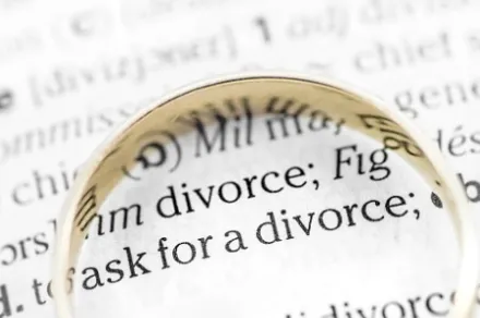 divorce paperwork with gold ring on top