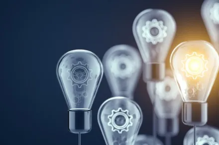 group of lightbulbs with one lit up