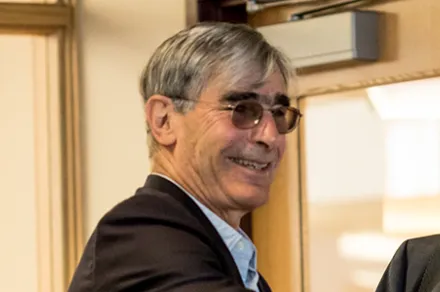 man with glasses smiling