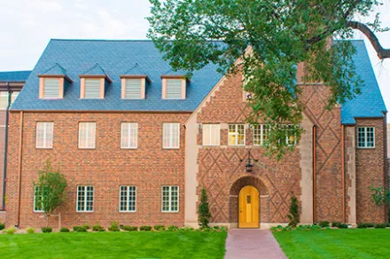 exterior of brick building with dark roof