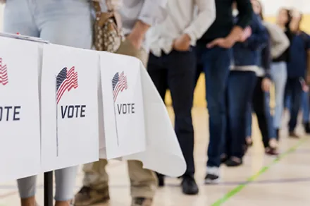 people waiting in line to vote