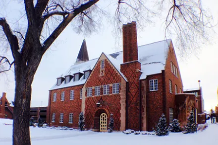 red brick building in snow